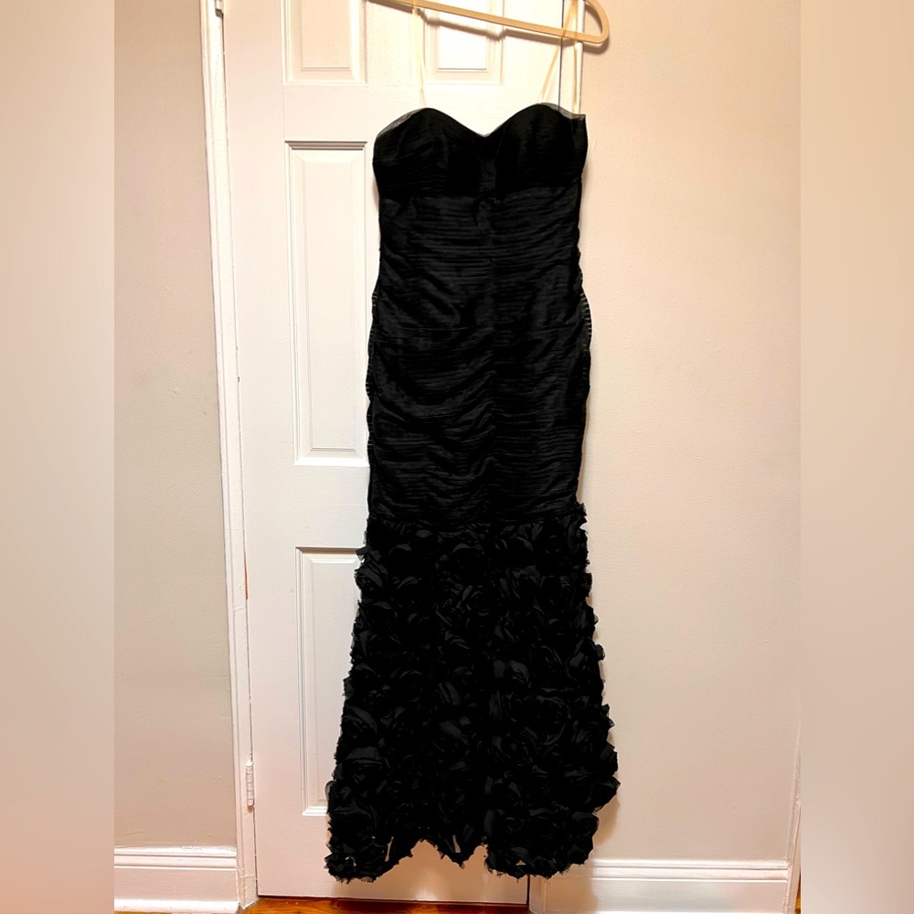 J S Collections long strapless dress with embroidered flowers on the bottom